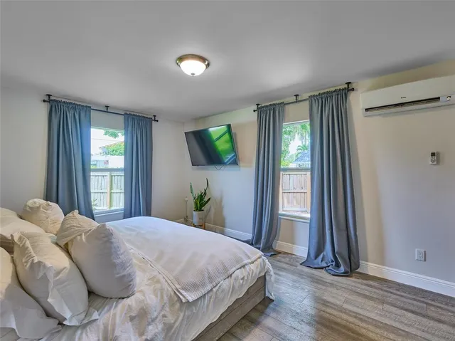 a bedroom with a bed and a couch