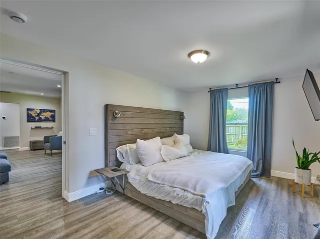 a bathroom with a shower sink and mirror