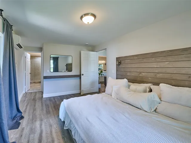 a bathroom with double sink and a mirror
