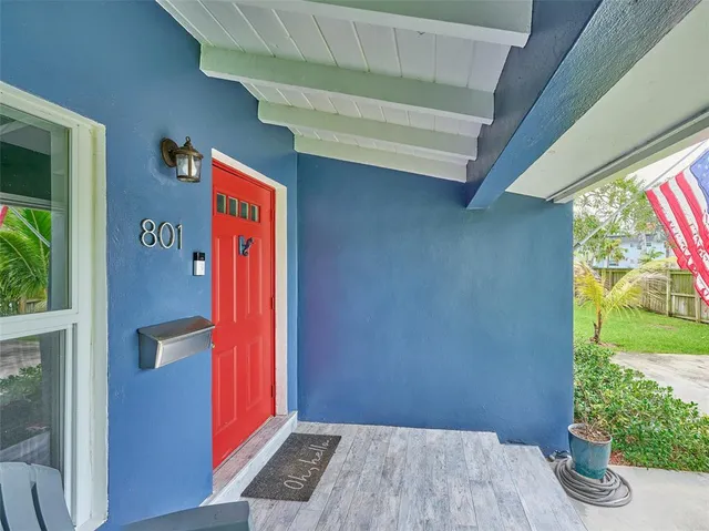 a view of a house with a yard and a garden