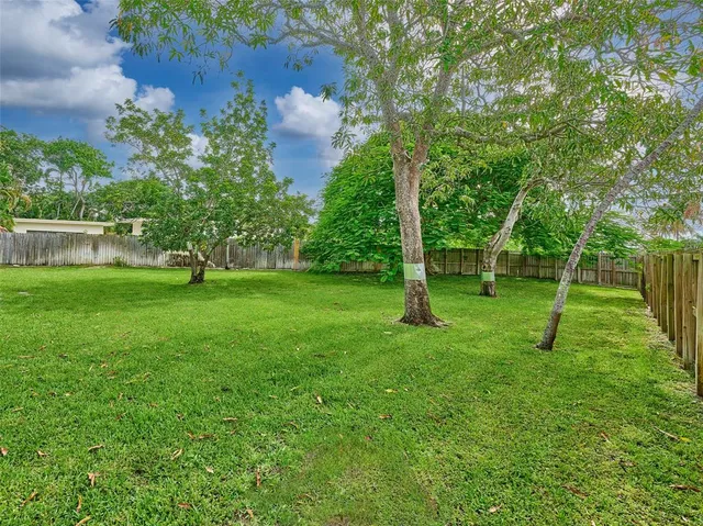 a view of a house with backyard porch and furniture