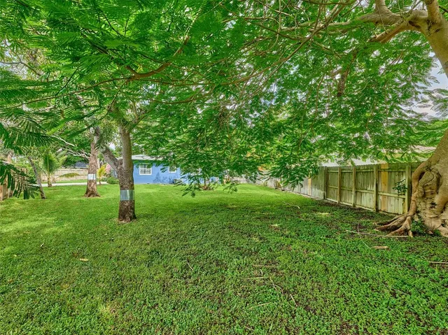 a view of a deck with furniture and a yard