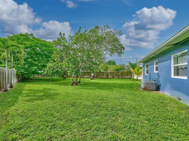 a view of backyard with furniture and garden