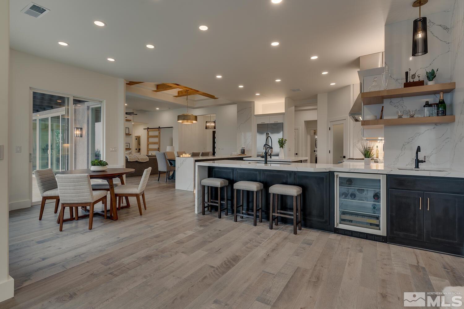 6109 Mesa Road Reno, NV 89511 - Photo 11 of 40 a kitchen with lots of wooden furniture appliances and dining table