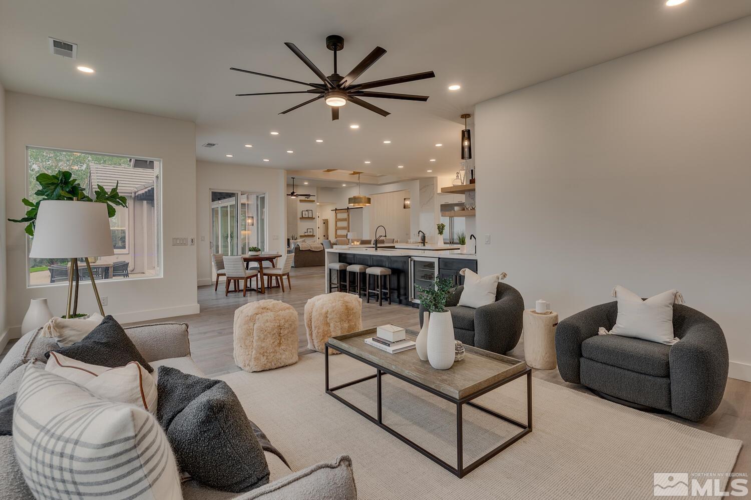 6109 Mesa Road Reno, NV 89511 - Photo 13 of 40 a living room with furniture and a chandelier