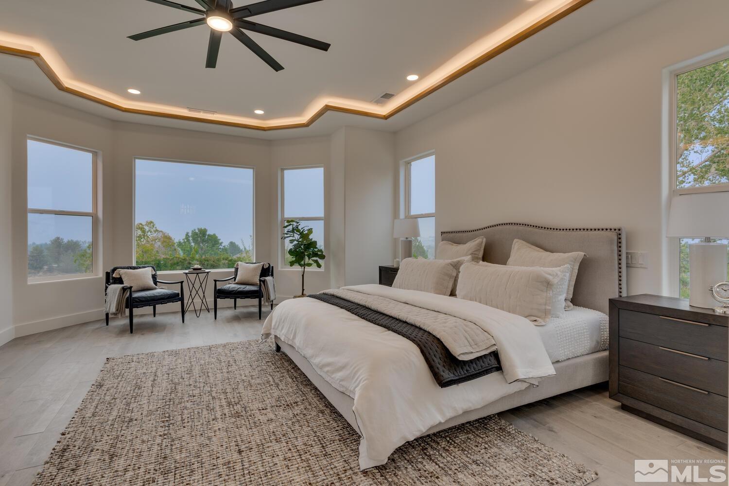 6109 Mesa Road Reno, NV 89511 - Photo 14 of 40 a bed room with a bed and a chair