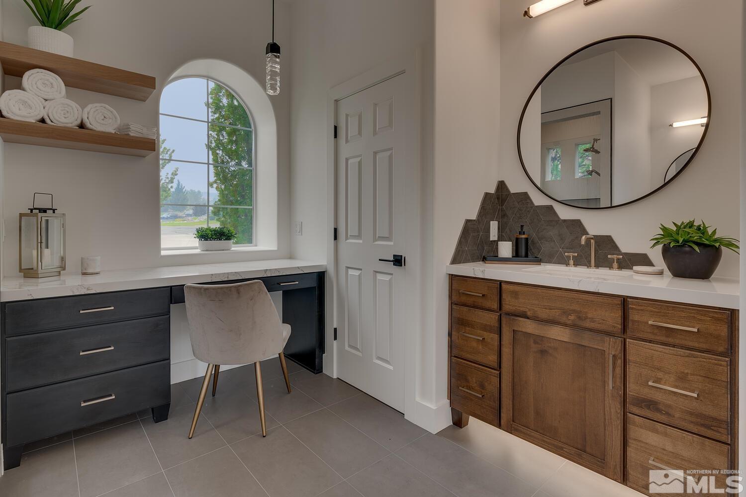 6109 Mesa Road Reno, NV 89511 - Photo 16 of 40 a room with a mirror a sink and a window