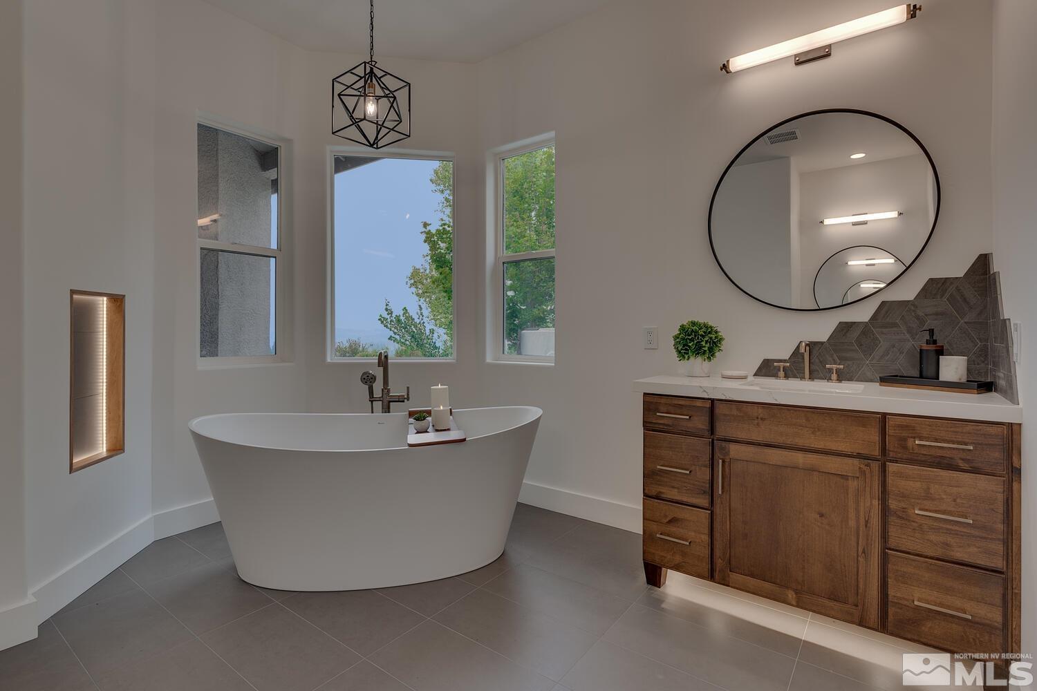 6109 Mesa Road Reno, NV 89511 - Photo 17 of 40 a bathroom with a sink and a mirror