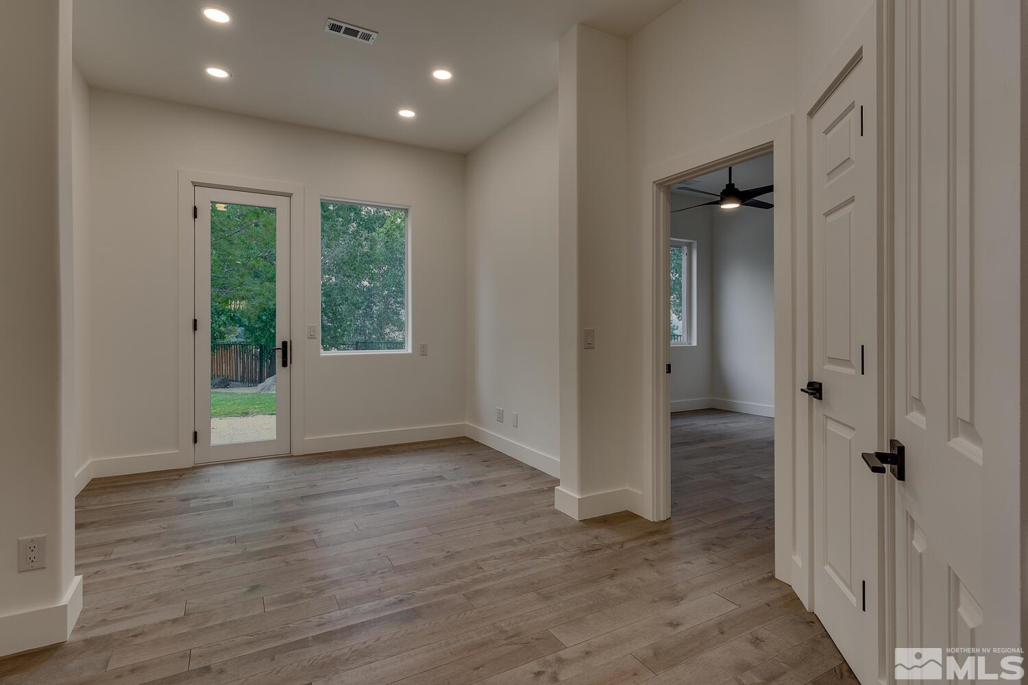 6109 Mesa Road Reno, NV 89511 - Photo 19 of 40 wooden floor in an empty room with a window