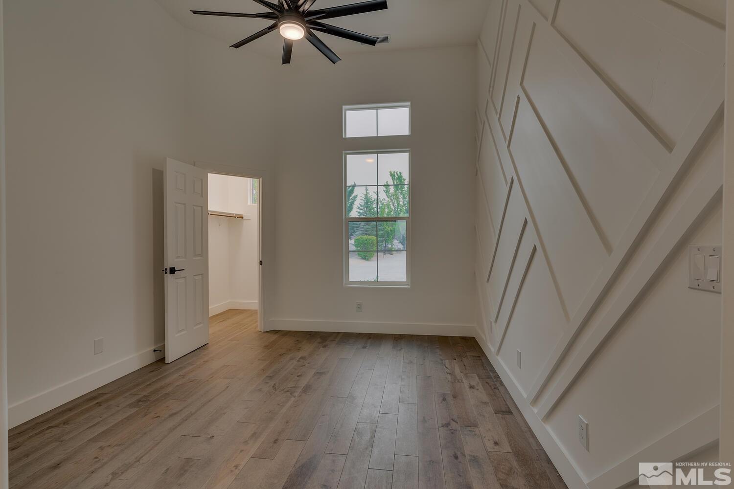 6109 Mesa Road Reno, NV 89511 - Photo 25 of 40 a view of empty room with wooden floor and fan