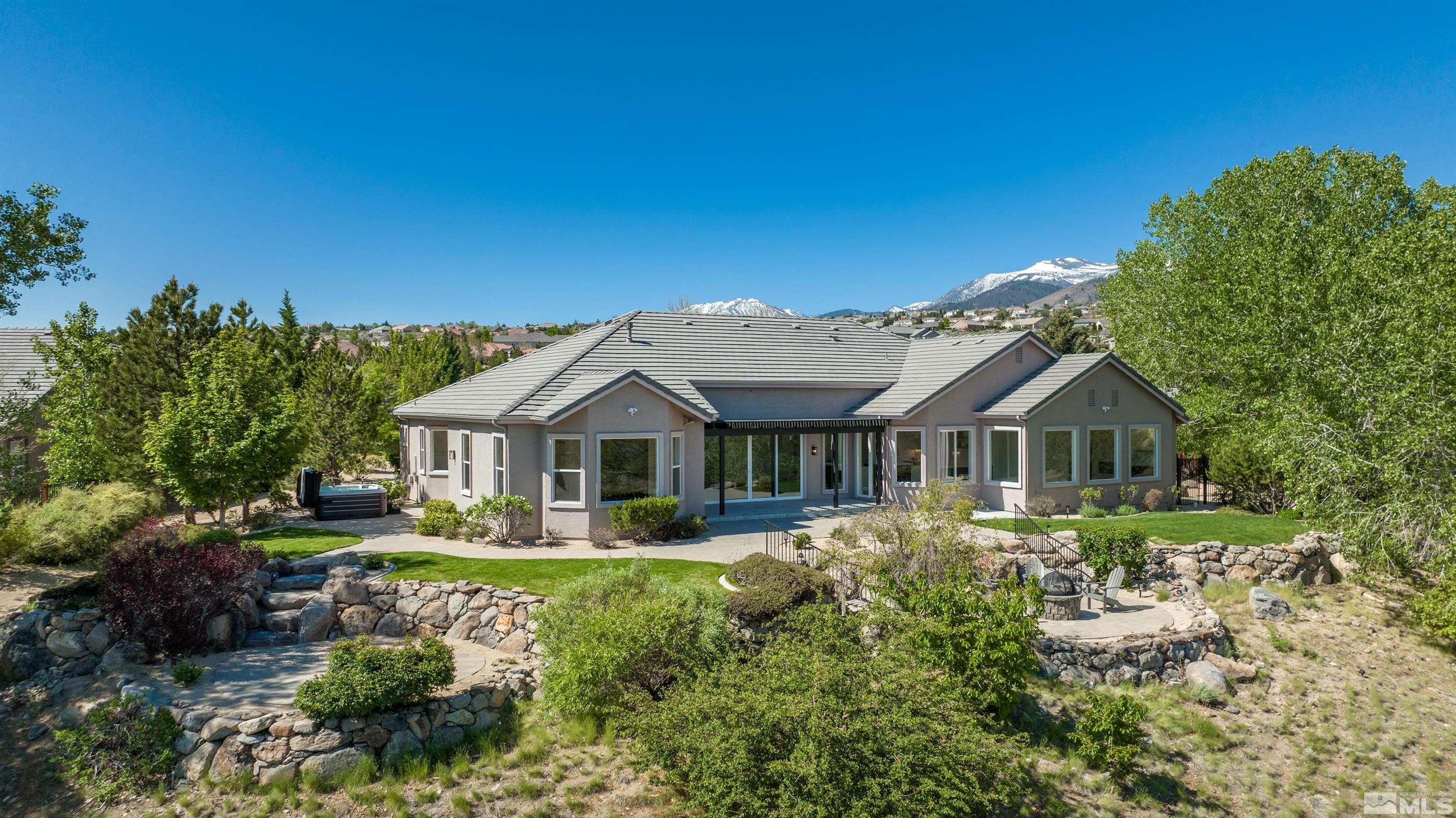6109 Mesa Road Reno, NV 89511 - Photo 36 of 40 a front view of a house with a garden and plants