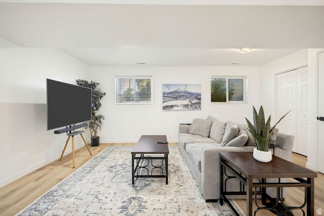 1723 Albury Road Sandy, UT 84092 - Photo 16 of 23 Spacious living area featuring light wood-finish flooring, white walls, and a recessed ceiling light