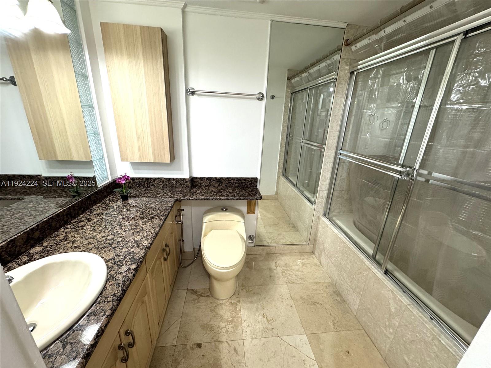 1824 Brickell Avenue, Unit 4C Miami, FL 33129 - Photo 17 of 30 Master Bathroom with Jacuzzi Tub