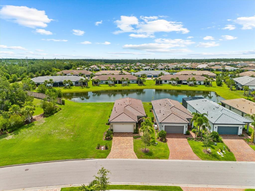 6791 Alstead Circle Lakewood Ranch, FL 34202 - Photo 12 of 25 an aerial view of residential houses with outdoor space