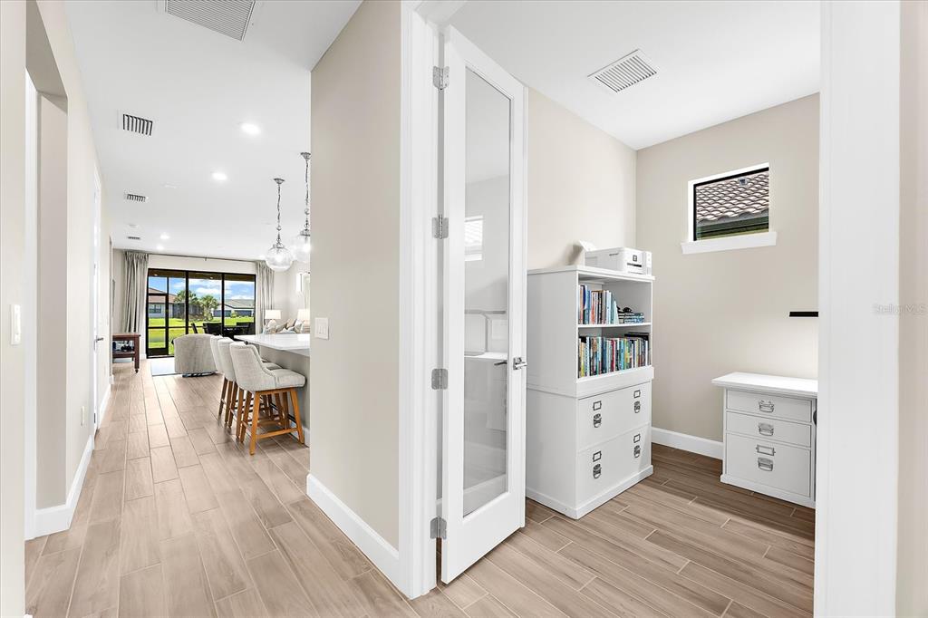 6791 Alstead Circle Lakewood Ranch, FL 34202 - Photo 8 of 25 a living room with furniture and wooden floor