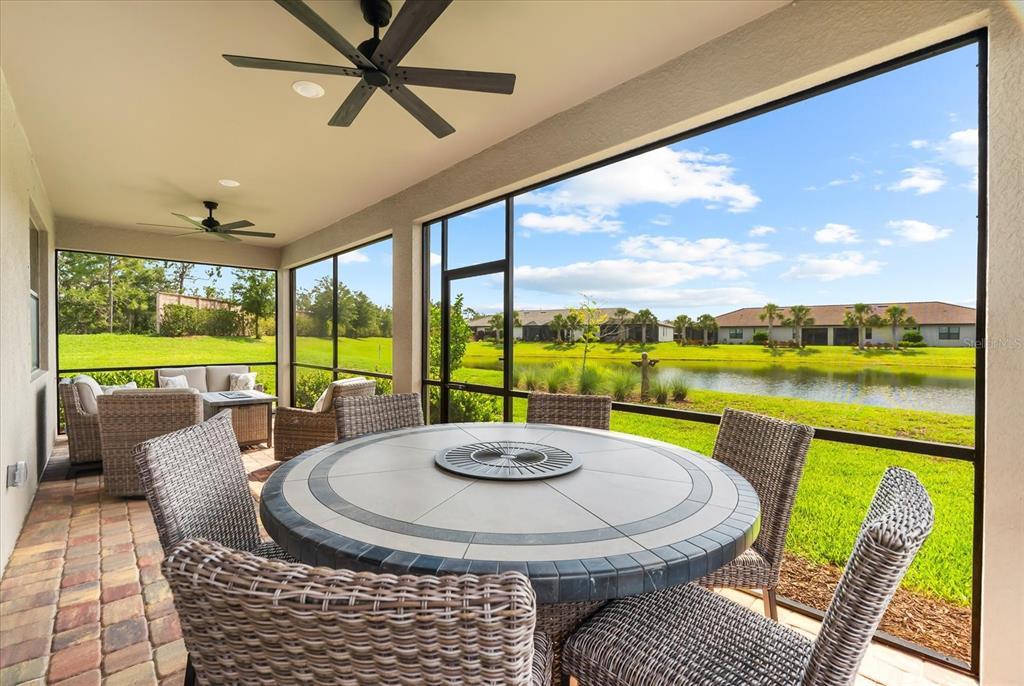 6791 Alstead Circle Lakewood Ranch, FL 34202 - Photo 10 of 25 a view of a dining room with a table and chairs