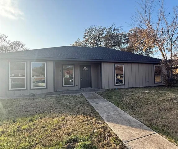 front view of a house with a yard