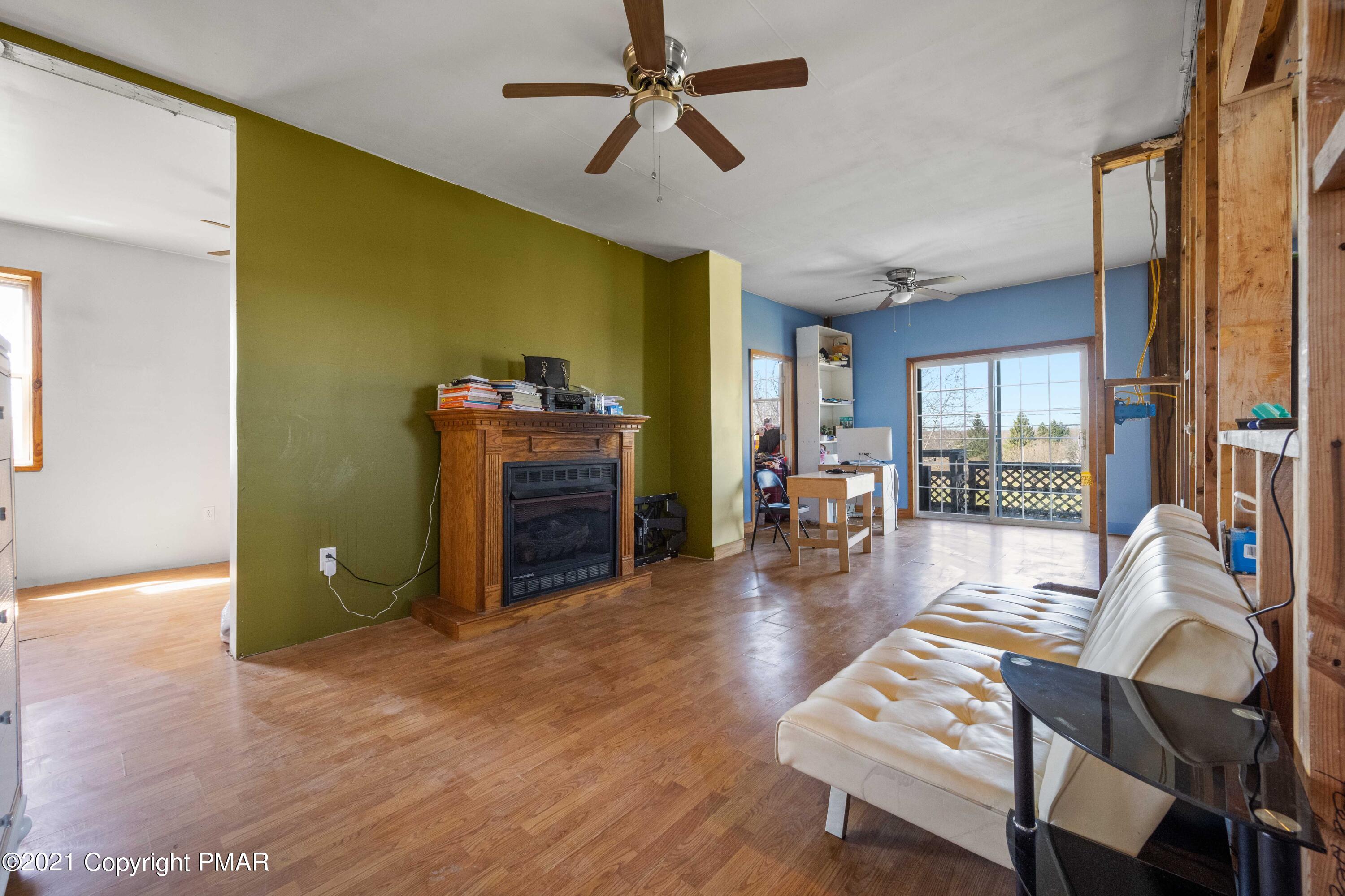 1571 State Rte 2016 Nicholson, PA 18446 - Photo 12 of 28 a living room with furniture a dining table and wooden floor