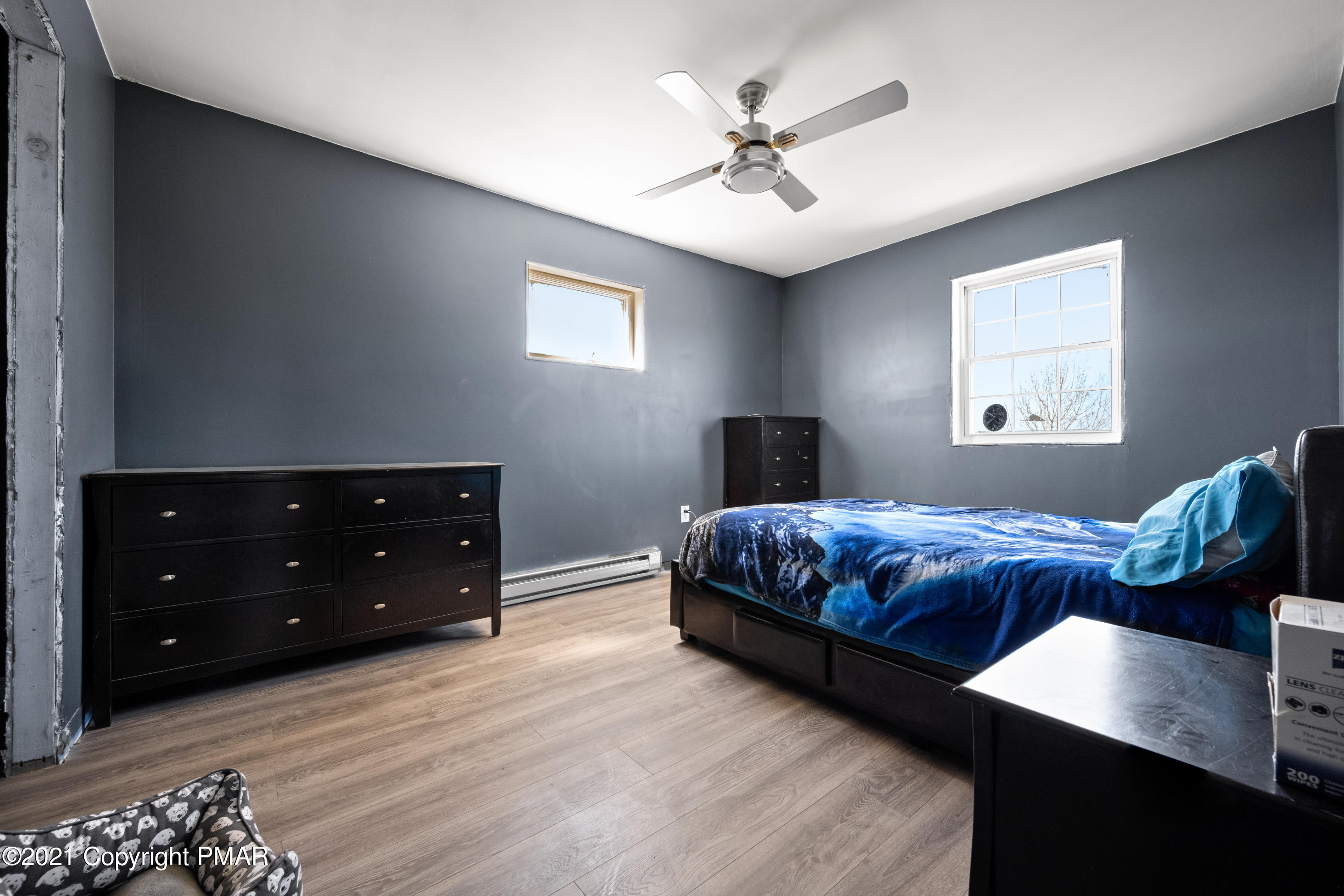 1571 State Rte 2016 Nicholson, PA 18446 - Photo 16 of 28 a bedroom with a bed and a chandelier