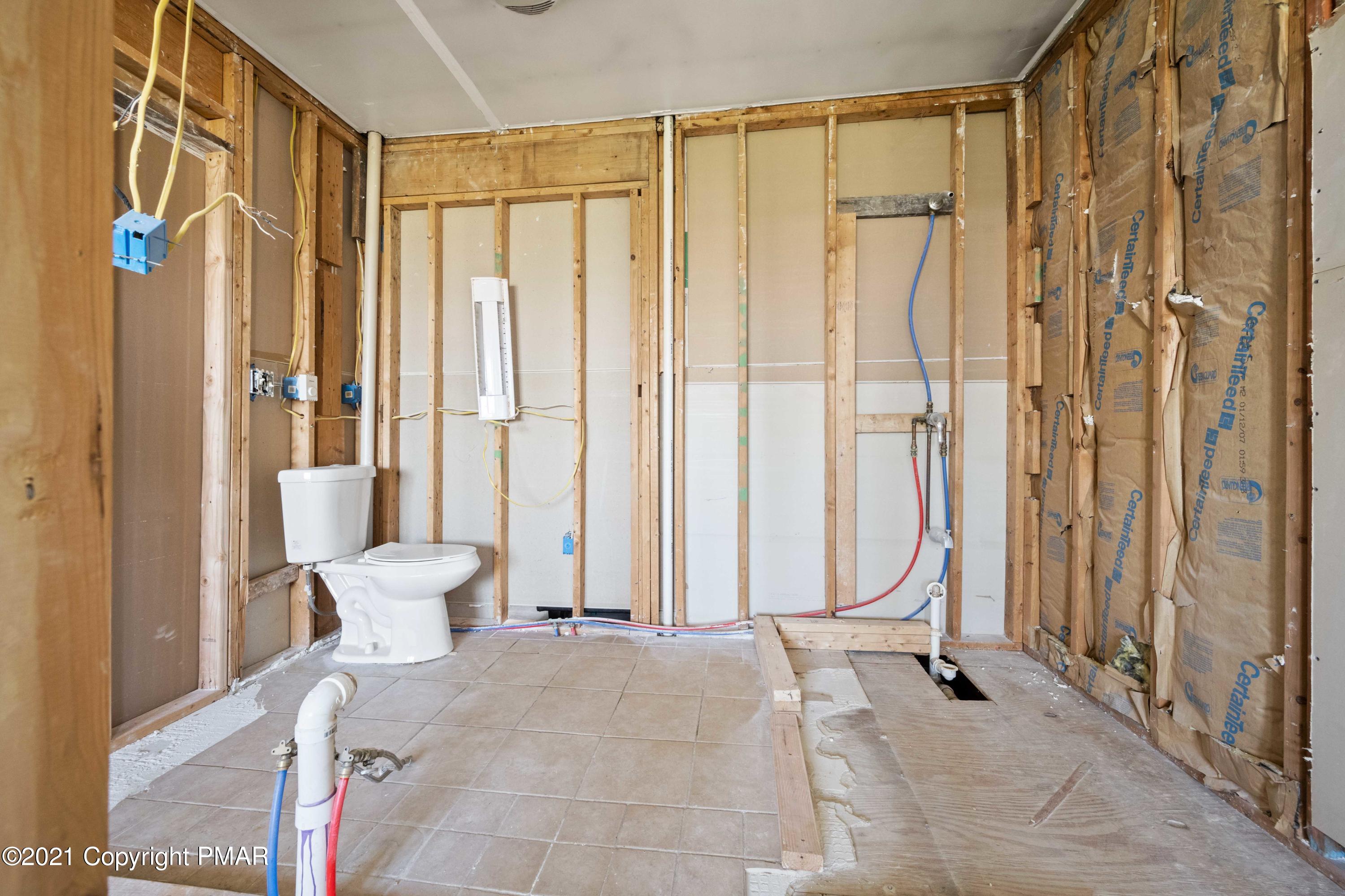 1571 State Rte 2016 Nicholson, PA 18446 - Photo 22 of 28 a view of a bathroom with a shower and a chair