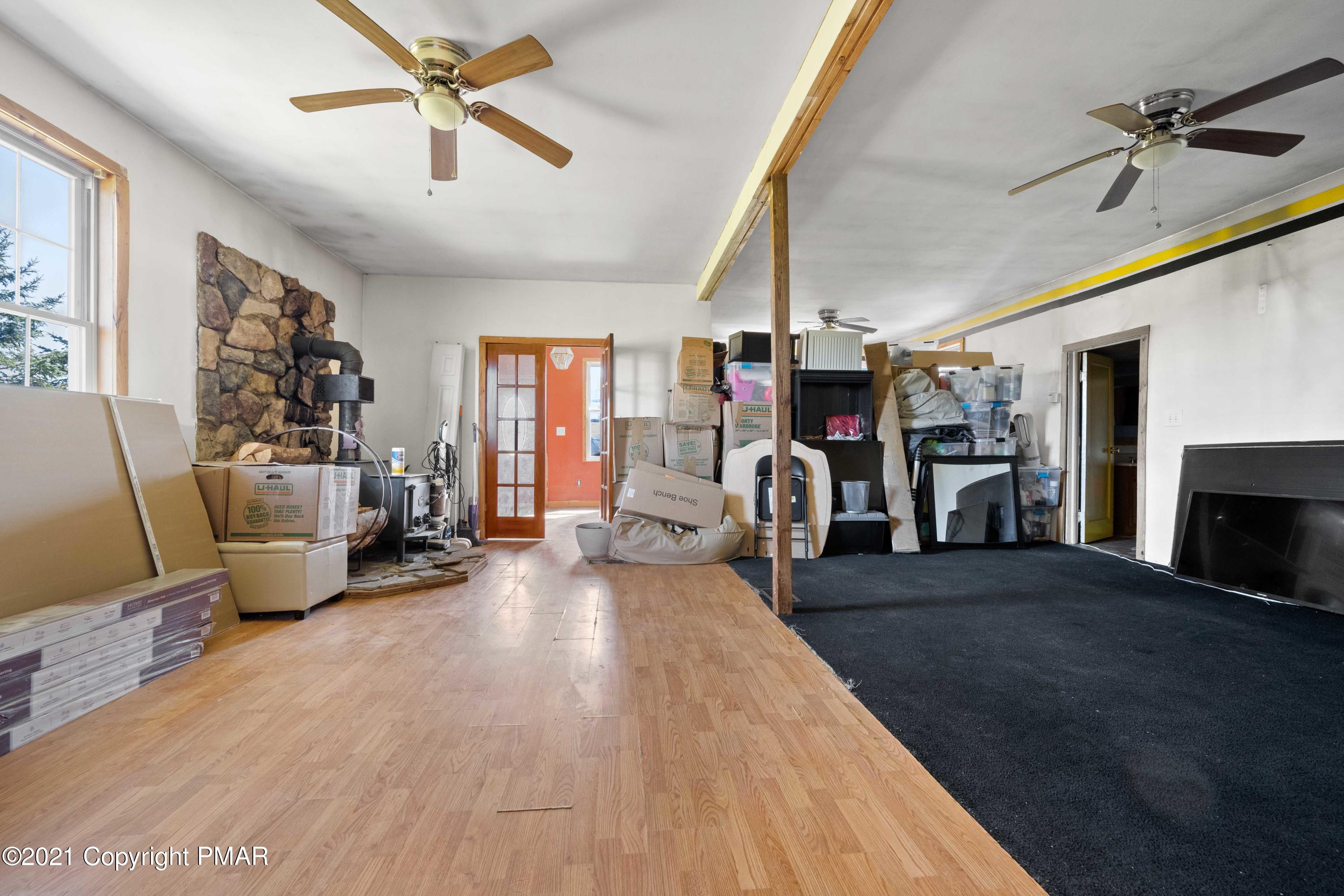 1571 State Rte 2016 Nicholson, PA 18446 - Photo 4 of 28 a living room with furniture and a fireplace