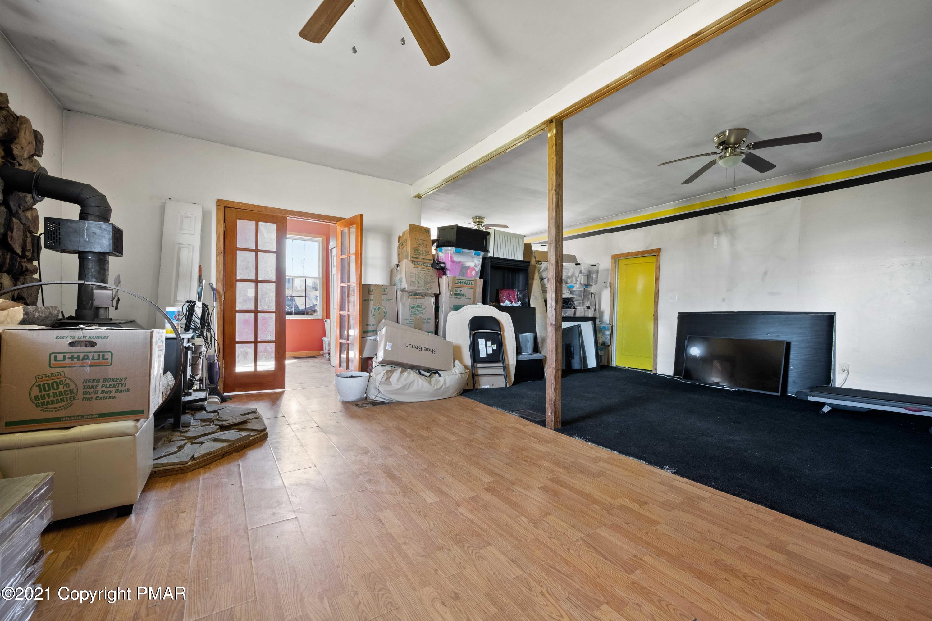 1571 State Rte 2016 Nicholson, PA 18446 - Photo 7 of 28 a living room with furniture and a fireplace