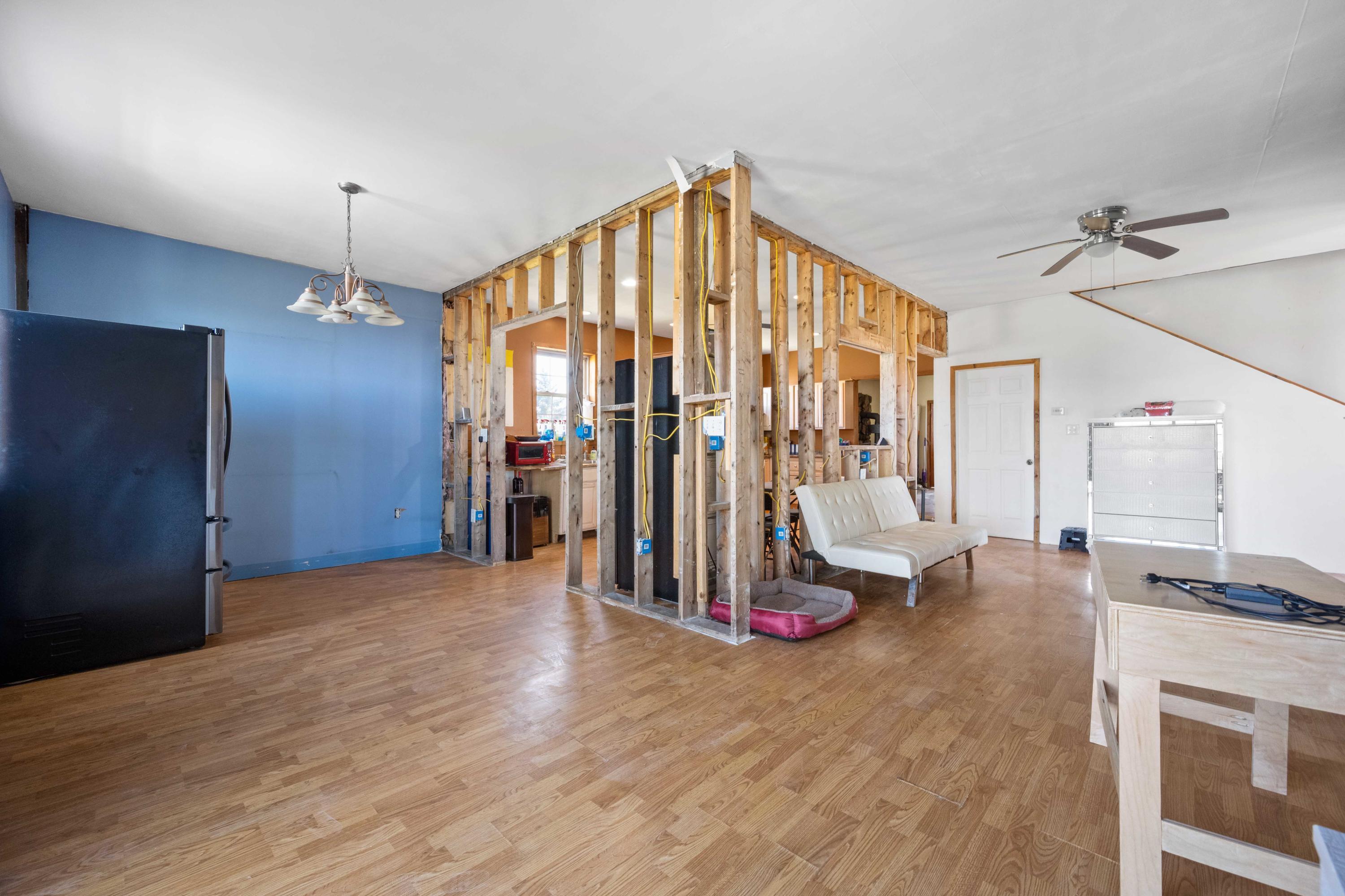 1571 State Rte 2016 Nicholson, PA 18446 - Photo 10 of 28 a view of an empty room with a fireplace and chandelier