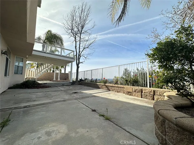 a view of a couches with wooden fence