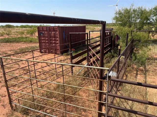 a room with water heater and wooden floor