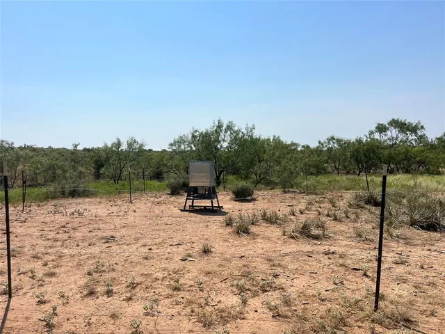 a view of a lake with a house in the background