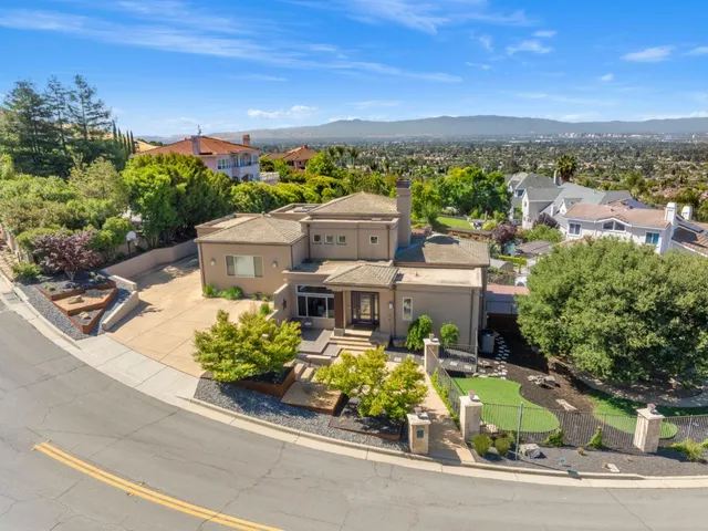 an aerial view of a house with a garden