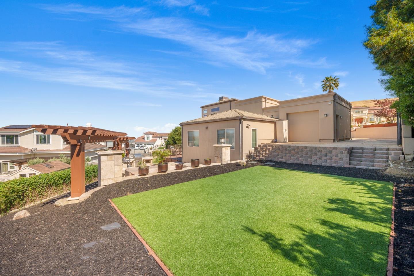 3574 Sweigert Road San Jose, CA 95132 - Photo 11 of 12 a view of a house with a yard and a garden