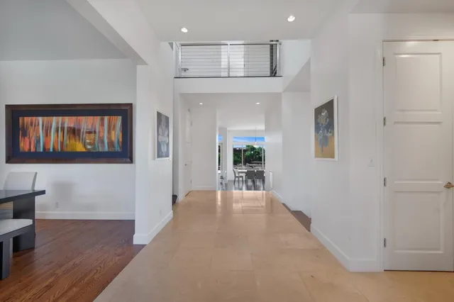 a view of a livingroom with furniture and a ceiling fan