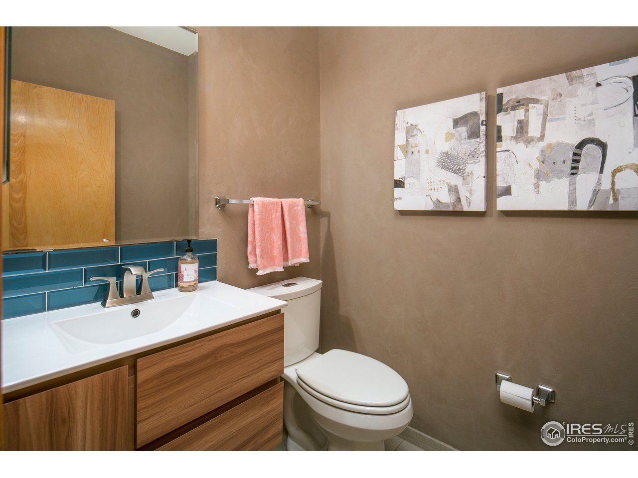 4742 16th Street Boulder, CO 80304 - Photo 12 of 38 a bathroom with a sink mirror vanity and toilet