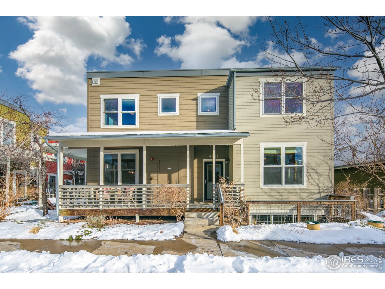 4742 16th Street Boulder, CO 80304 - Photo 2 of 38 a front view of a house with a yard