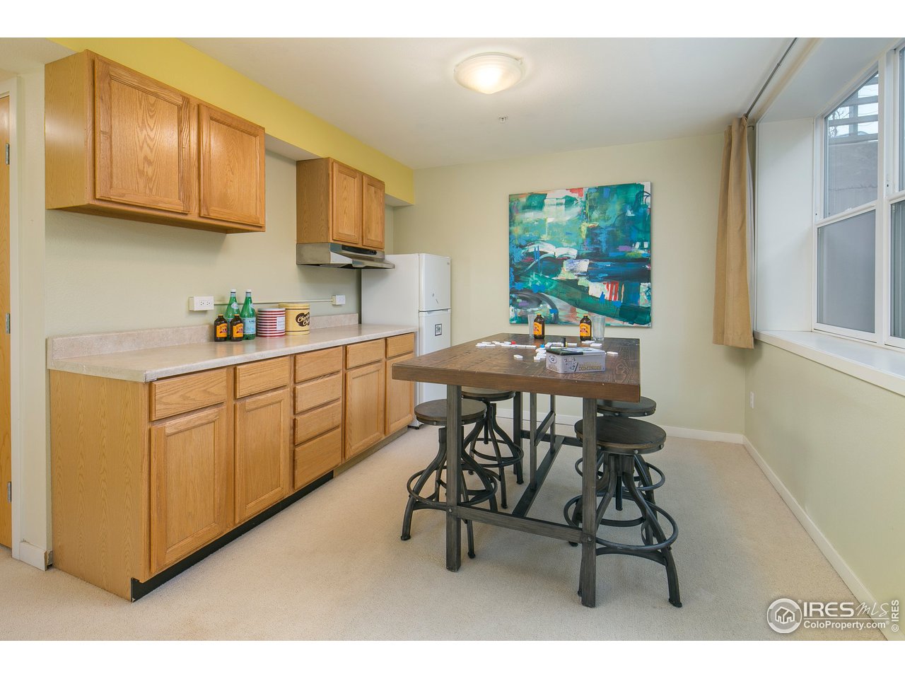 4742 16th Street Boulder, CO 80304 - Photo 26 of 38 a kitchen with stainless steel appliances a sink a stove a table and chairs