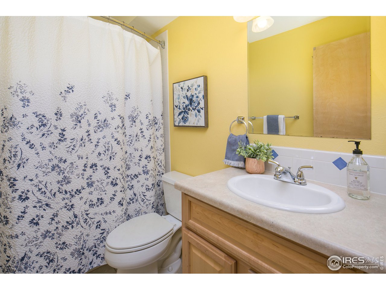 4742 16th Street Boulder, CO 80304 - Photo 27 of 38 a bathroom with a sink toilet and mirror
