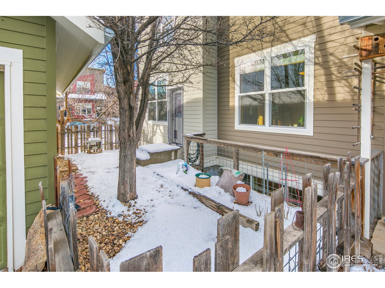 4742 16th Street Boulder, CO 80304 - Photo 29 of 38 a backyard of a house with table and chairs