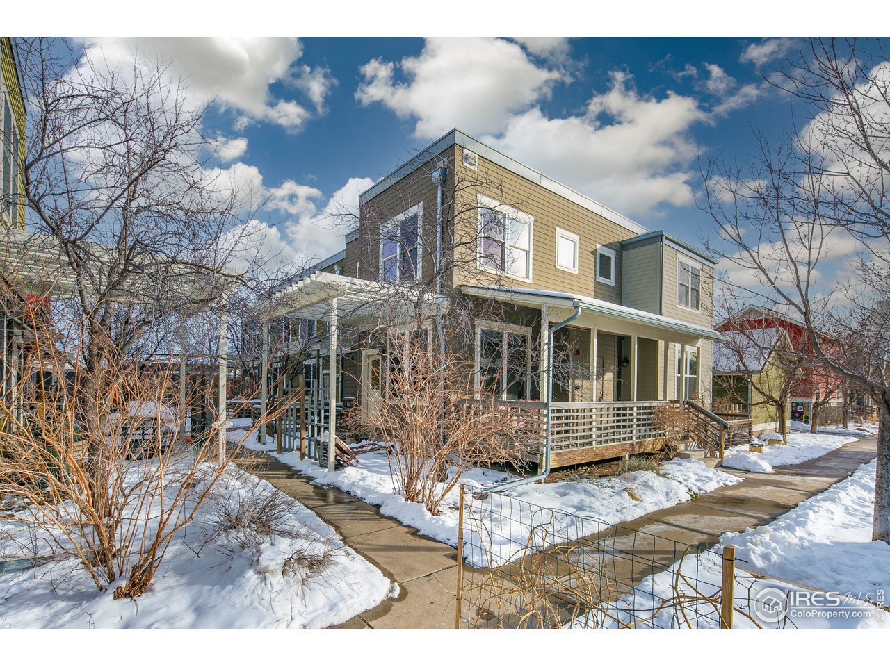 4742 16th Street Boulder, CO 80304 - Photo 30 of 38 a front view of a house with a yard