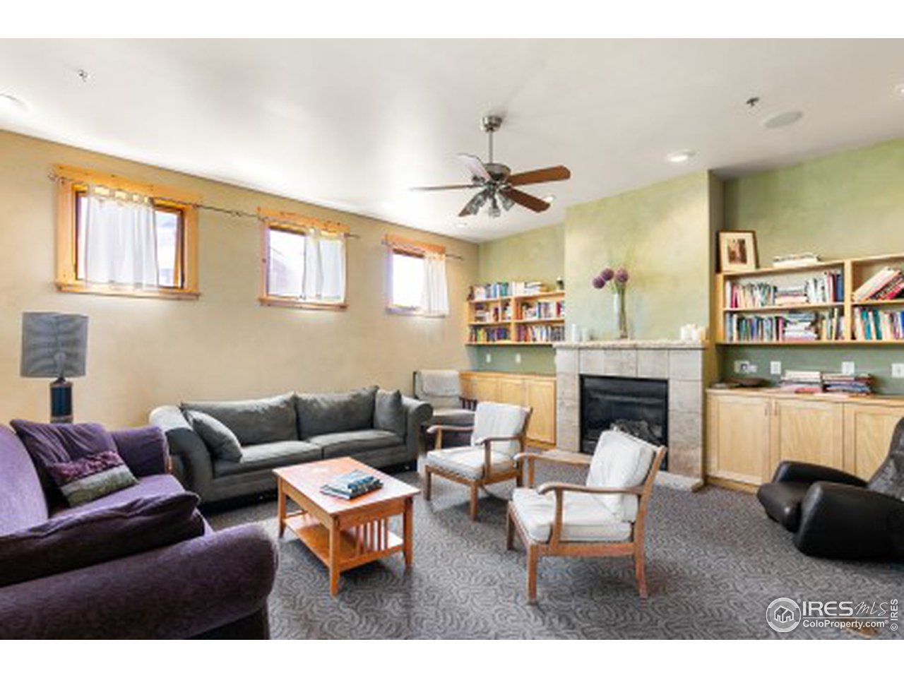 4742 16th Street Boulder, CO 80304 - Photo 33 of 38 a living room with furniture a fireplace and a kitchen view