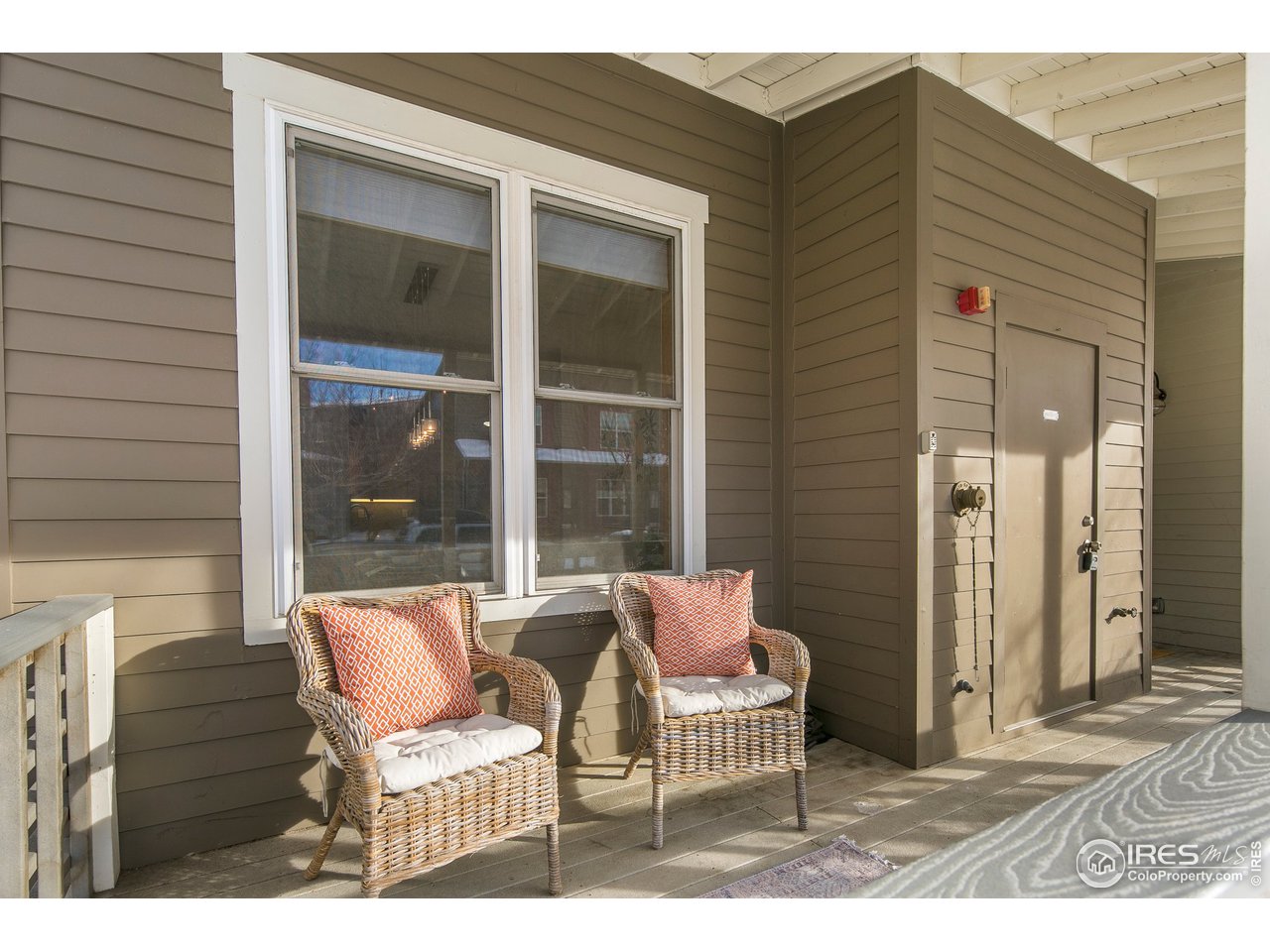 4742 16th Street Boulder, CO 80304 - Photo 4 of 38 a balcony with table and chairs
