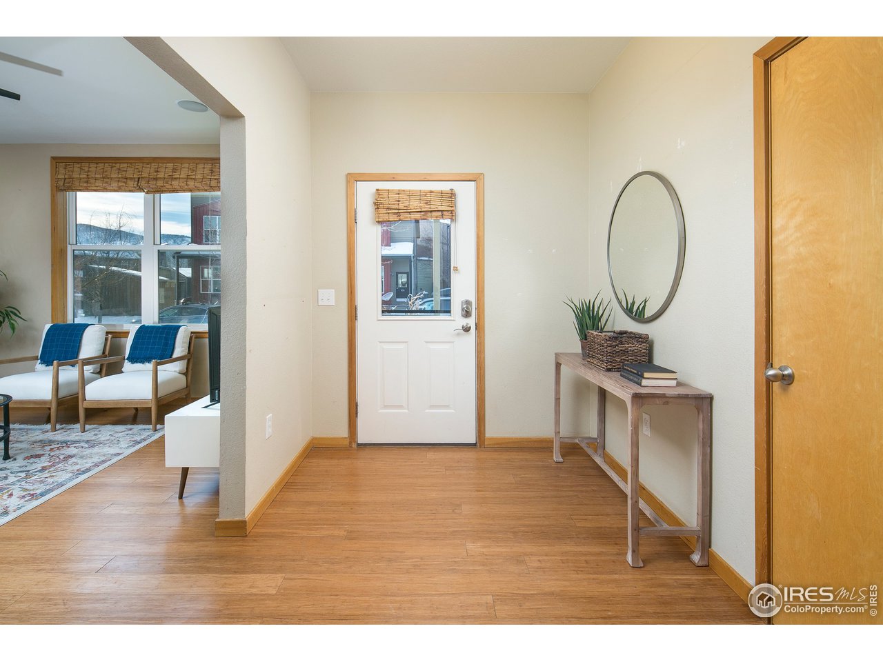 4742 16th Street Boulder, CO 80304 - Photo 6 of 38 a living room with a table chairs and a wooden floor