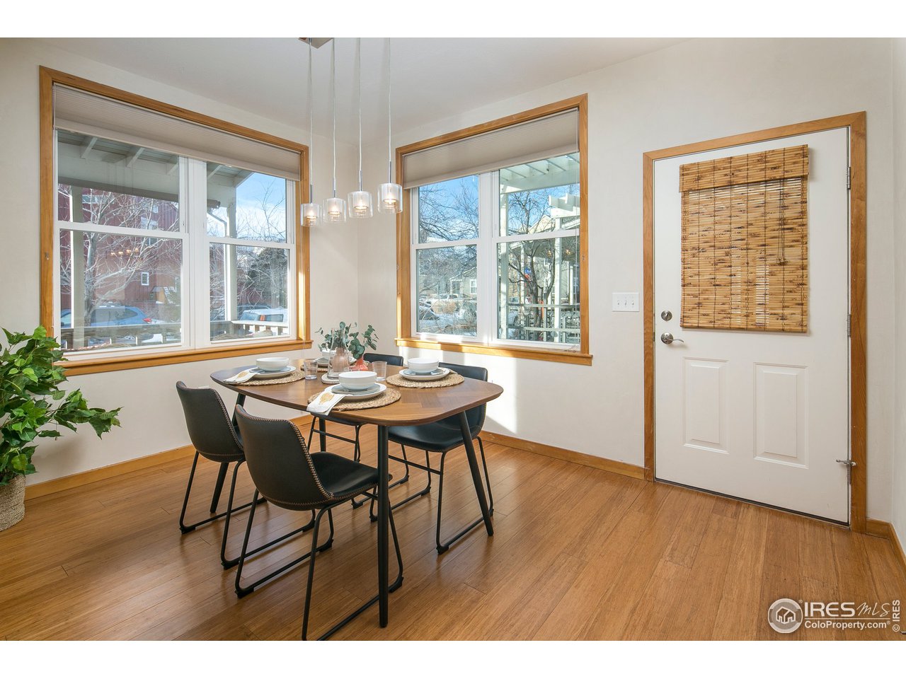 4742 16th Street Boulder, CO 80304 - Photo 10 of 38 a view of a dining room with furniture and wooden floor