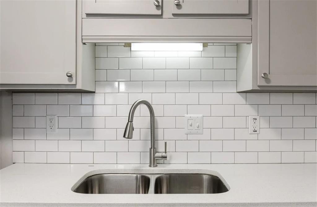 2330 Cobb Parkway Southeast, Unit 1111 Smyrna, GA 30080 - Photo 2 of 19 a bathroom with a sink and cabinets