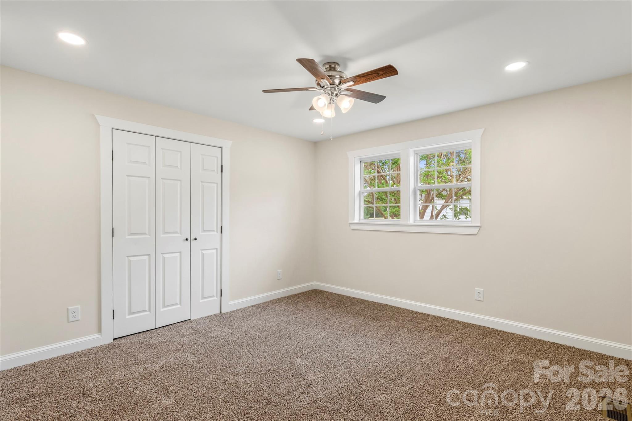 2480 Artz Road Salisbury, NC 28146 - Photo 28 of 33 an empty room with windows and fan