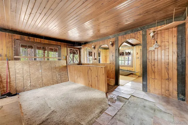 a view of an empty room with a bathroom