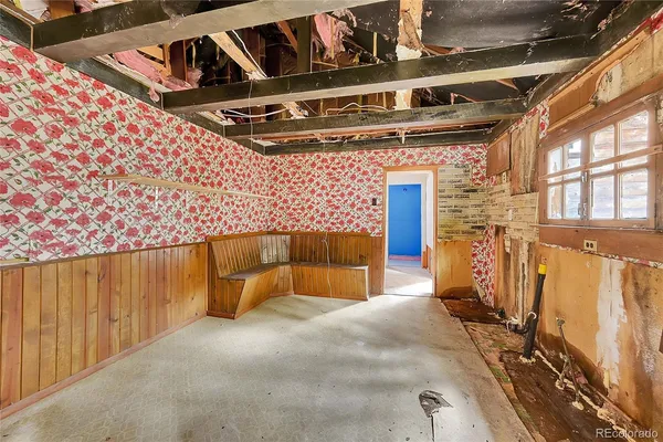 a spacious bedroom with a large bed and large windows