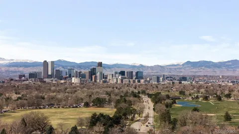 a view of a town with mountains in the background