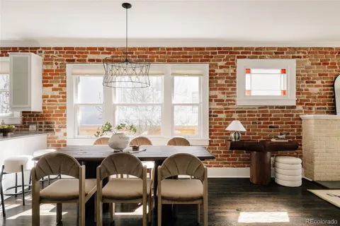 a view of a dining room with furniture window and outside view