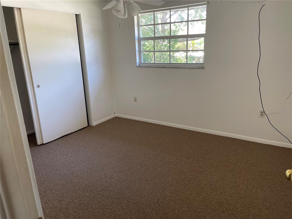 236 Davis Boulevard Sarasota, FL 34237 - Photo 7 of 10 an empty room with windows